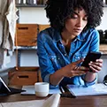 african american woman looking at a phone