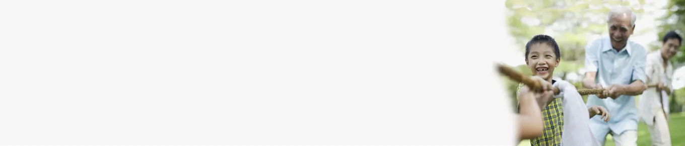 children playing baseball with grandfather