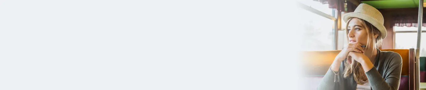 young woman with blonde hair wearing a hat