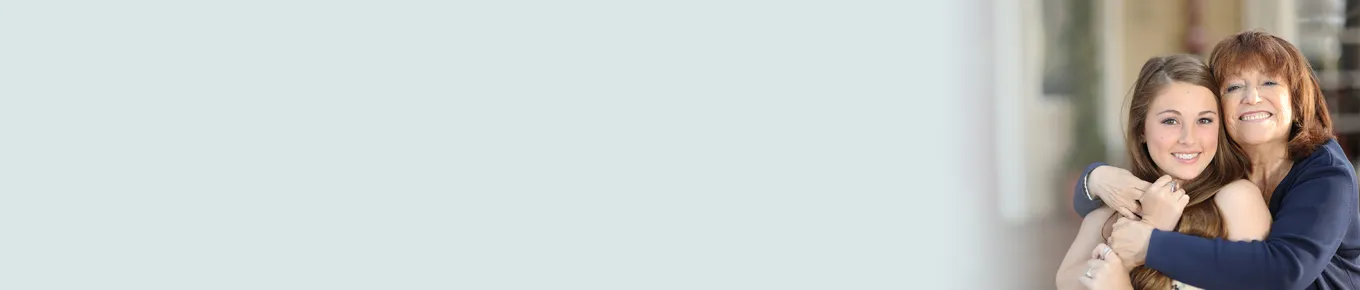 woman hugging young girl