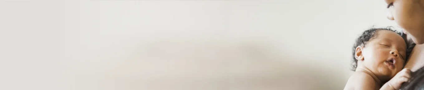 woman holding newborn baby