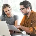 Woman and man reviewing document