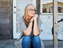 woman sitting on front porch