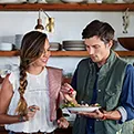 couple sharing food from a plate